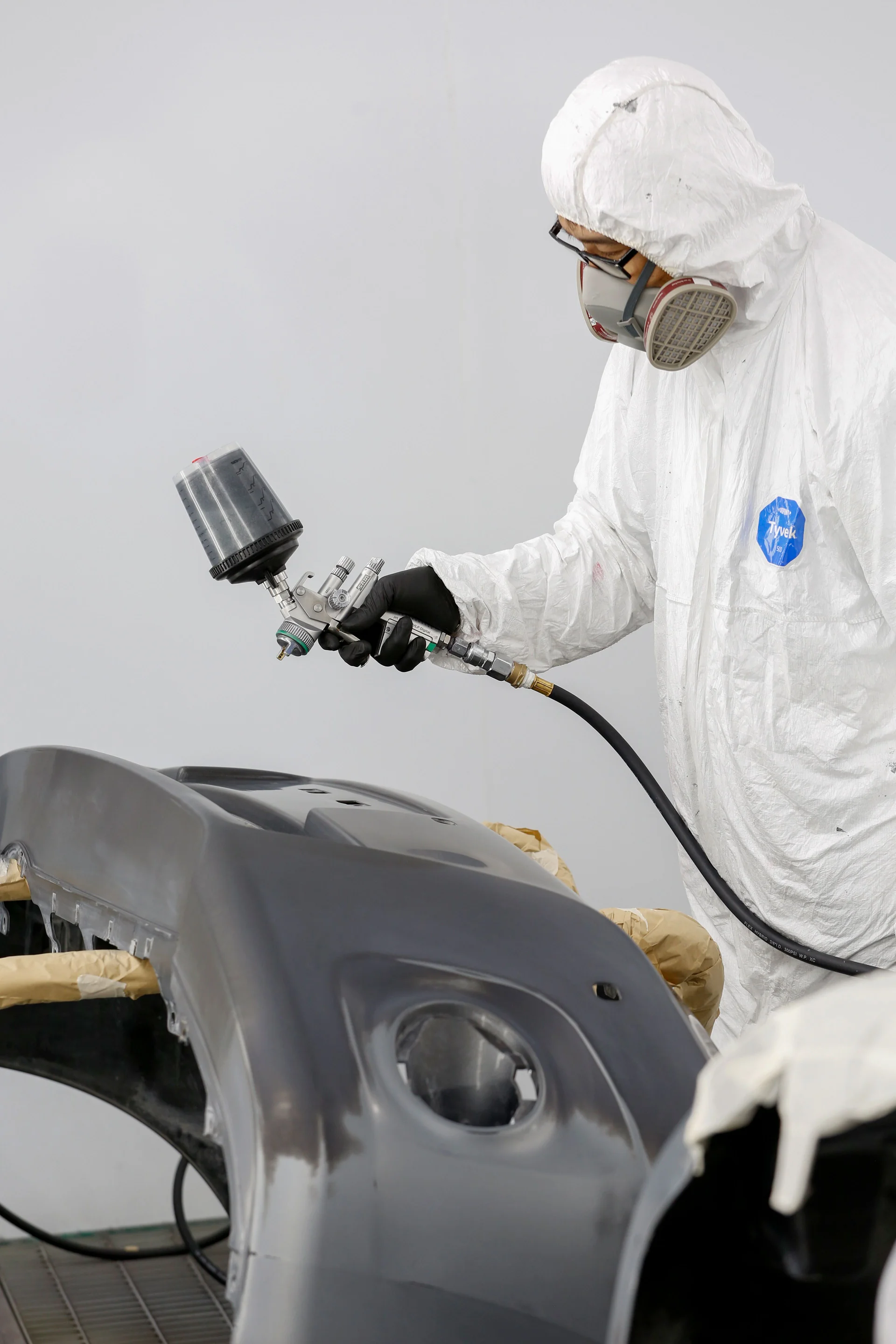 Close-up of professional automotive body repair tools and equipment on a workshop bench